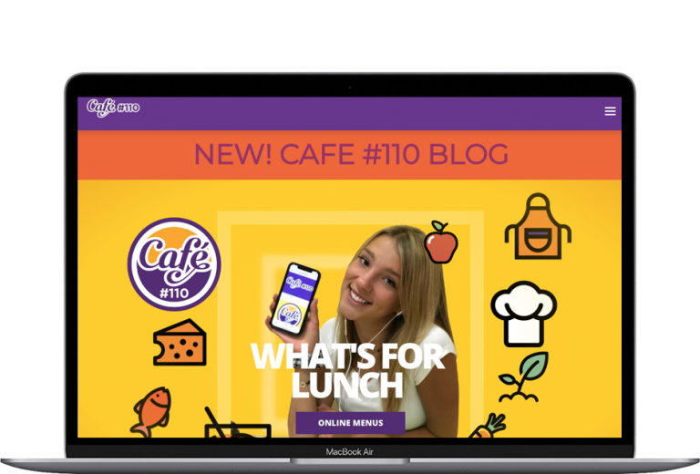 Cafe #110 website displayed on a laptop