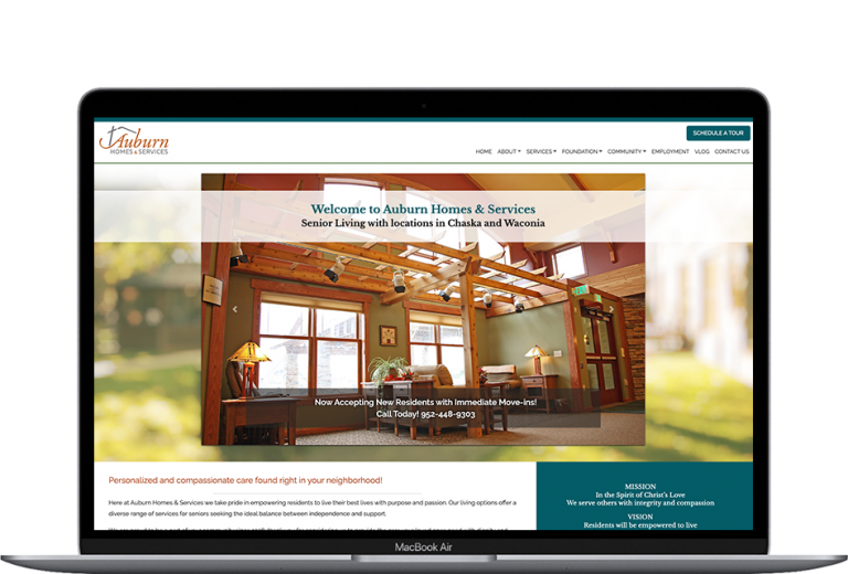 Auburn Home & Service website home page being displayed on a laptop