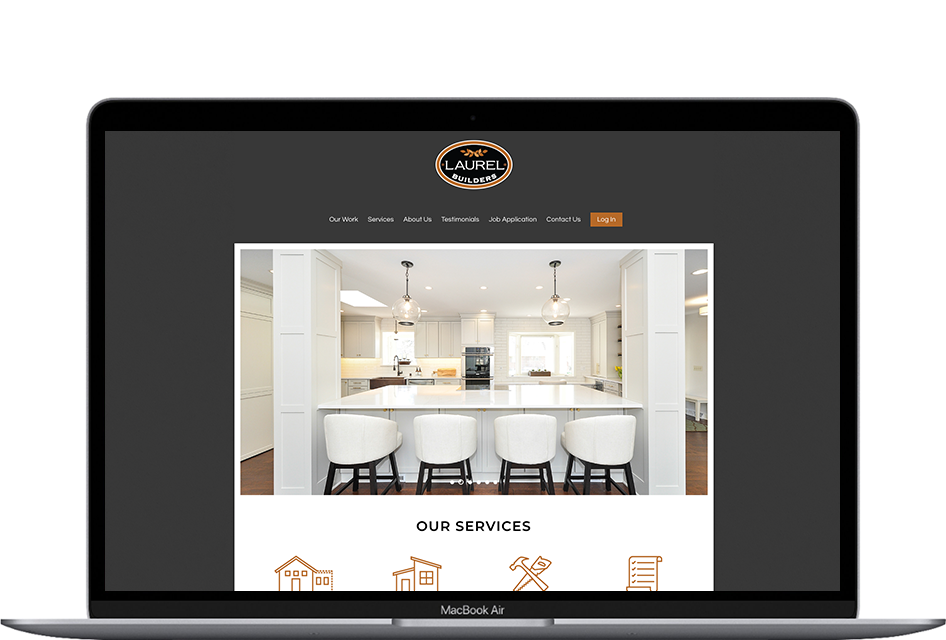 Laurel Builders website home page being displayed on a laptop